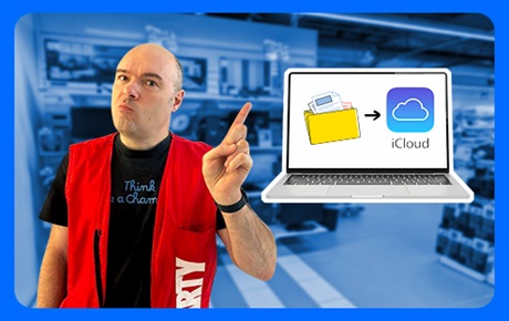 Un vendeur Darty montre un MacBook affichant des dossiers