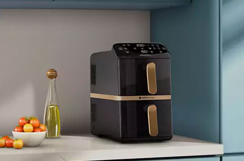 Airfryer Philips NA462/70 posé sur un plan de travail